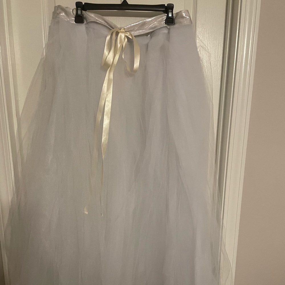 Handmade tulle skirt would be cute over some dark denim jeans and heels